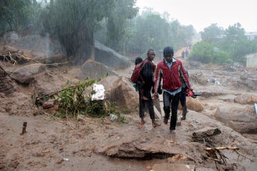 Residents survey the damage caused by Cyclone Freddy in Chilobwe, Blantyre, Malawi, March 13, 2023. (Reuters)