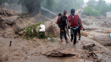 Residents survey the damage caused by Cyclone Freddy in Chilobwe, Blantyre, Malawi, March 13, 2023. REUTERS/Eldson Chagara.