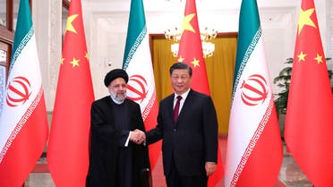 Iranian President Ebrahim Raisi shakes hands with Chinese President Xi Jinping during a welcoming ceremony in Beijing, China, February 14, 2023. (Reuters)