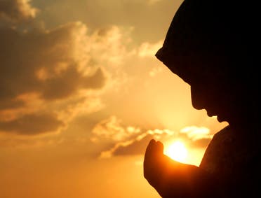 A girl prays during the Muslim fasting month of Ramadan in Amman September 24, 2006. (Reuters)