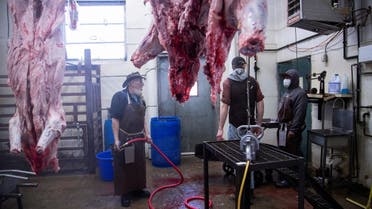 Workers converse at the abattoir of the First Capitol Meat Processing plant amid shortages of animal products due to supply chain issues created by the coronavirus disease (COVID-19) pandemic in Corydon, Indiana US January 31, 2022. (File photo: Reuters)