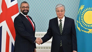 Kazakh President Kassym-Jomart Tokayev shakes hands with British Foreign Secretary James Cleverly during a meeting in Astana, Kazakhstan March 18, 2023. (Press service of the President of Kazakhstan/Handout via Reuters)