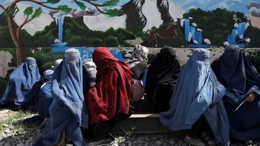 Afghan women wait to receive a food package being distributed by a Saudi Arabia humanitarian aid group at a distribution center in Kabul, Afghanistan, on April 25, 2022. (Reuters)