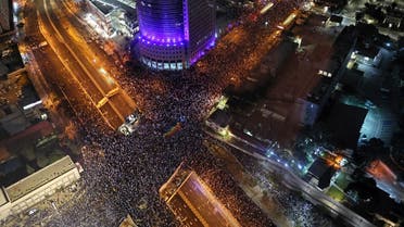 Protesters gather for an 11th straight week of protests against the government's controversial judicial overhaul bill in Tel Aviv on March 18, 2023. (AFP)