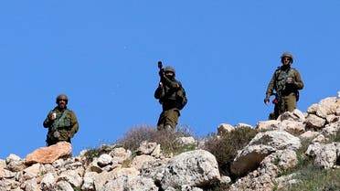 Israeli soldiers fire tear gas canister toward Palestinian demonstrators (not pictured) during clashes following a protest against the expansion of Jewish settlements, on March 17, 2023, in the West Bank village of Beit Dajan, east of Nablus. (AFP)