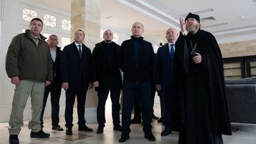 Russian President Vladimir Putin, accompanied by Governor of Sevastopol Mikhail Razvozhayev and Metropolitan Tikhon (Shevkunov), chairman of the Patriarchal Council for Culture, visits a children's arts and aesthetic center in Sevastopol, Crimea March 18, 2023. (Reuters)