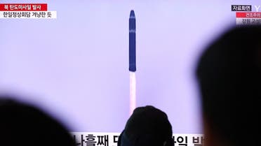 People watch a TV broadcasting a news report on North Korea firing a ballistic missile into the sea off its east coast, at a railway station in Seoul, South Korea, March 16, 2023. REUTERS/Kim Hong-Ji