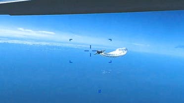 A Russian Su-27 military aircraft dumps fuel while flying towards a U.S. Air Force MQ-9 Reaper drone over the Black Sea, March 14, 2023 in this still image taken from handout video released by the Pentagon. Courtesy of U.S. European Command/The Pentagon/Handout via REUTERS THIS IMAGE HAS BEEN SUPPLIED BY A THIRD PARTY. MANDATORY CREDIT.