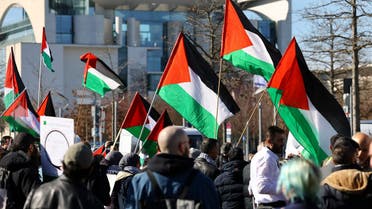 People holding the Palestinian flag, protest against Israeli Prime Minister Benjamin Netanyahu during Netanyahu's visit to Germany in Berlin, Germany, March 16, 2023. (Reuters)
