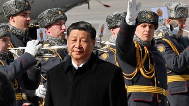 Chinese President Xi Jinping walks past honour guards and members of a military band during a welcoming ceremony upon his arrival at an airport in Moscow, Russia, March 20, 2023. (Reuters)