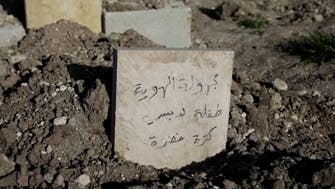 At graveyard of unknown quake victims, Syrians seek news of the missing
