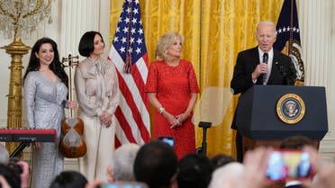 From left, performer Sahba Motallebi, Rana Mansour, an Iranian-American singer-songwriter, and first lady Jill Biden listen as President Joe Biden speaks during a Nowruz celebration in the East Room of the White House, Monday, March 20, 2023, in Washington. (AP)