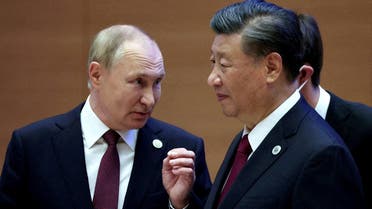 Russian President Vladimir Putin speaks with Chinese President Xi Jinping before an extended-format meeting of heads of the Shanghai Cooperation Organization summit (SCO) member states in Samarkand, Uzbekistan, on September 16, 2022. (Reuters)