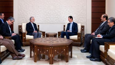 A handout picture released by the Syrian Arab News Agency (SANA) on January 21, 2018 shows Syrian President Bashar al-Assad (C-R) meeting with former Iranian Foreign Minister Kamal Kharrazi (C-L) in Damascus. (AFP)
