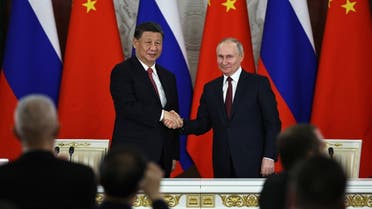 Russian President Vladimir Putin and China’s President Xi Jinping shake hands after delivering a joint statement following their talks at the Kremlin in Moscow on March 21, 2023. (Sputnik via AFP)