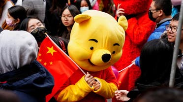 A parade participant in a Winnie the Pooh costume waves a Chinese flag before the Lunar New Year parade celebrating the Year of the Rabbit in the Chinatown neighborhood of New York, US, February 12, 2023. (File photo: Reuters)
