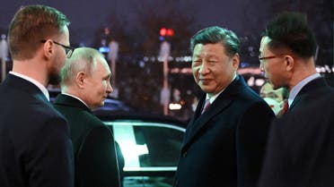 Russian President Vladimir Putin and Chinese President Xi Jinping leave after a reception in honor of the Chinese leader's visit to Moscow, at the Kremlin in Moscow, Russia, on March 21, 2023. (Reuters)