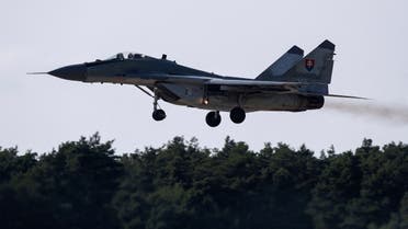Russian-made MiG-29 fighter jets fly over the Malacky Air Base, near Malacky, Slovakia, August 27, 2022. (Reuters)