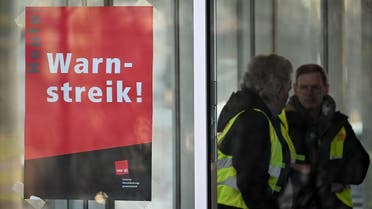 A strike warning poster can be seen on a window in Munich, southern Germany, on March 2, 2023. (AFP)