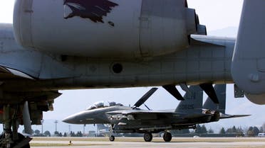 F-15 fighter plane lands behind a U.S. A-10 Thunderbolt ground attack plane at Aviano air base March 31. (File Photo: Reuters)
