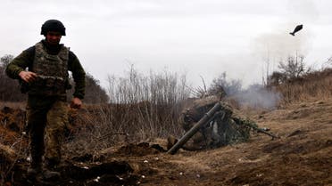 Ukrainian soldiers of the Paratroopers' of 80th brigade fire a mortar shell at a frontline position near Bakhmut, amid Russia's attack on Ukraine, in Donetsk region, Ukraine March 16, 2023. REUTERS/Violeta Santos Moura TPX IMAGES OF THE DAY