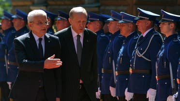 A file photo shows Turkey’s President Recep Tayyip Erdogan (C) and chairman of Bosnia and Herzegovina’s tripartite presidency Sefik Dzaferovic (L) inspect an honor guard of Bosnian armed forces during a welcoming ceremony in Sarajevo, on September 6, 2022. (AFP)