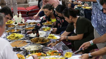 Foreign visitors and residents in the UAE eat an Emirati Iftar meal during the Muslim holy fasting month of Ramadan, at Sheikh Mohammed Centre for Cultural Understanding (SMCCU) in Dubai, UAE May 17, 2019. (Reuters)