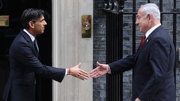 Britain’s Prime Minister Rishi Sunak (L) greets Israel’s Prime Minister Benjamin Netanyahu on the steps of 10 Downing Street in central London on March 24, 2023, ahead of their meeting. (AFP)