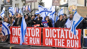 Demonstrators protest against Israeli Prime Minister Benjamin Netanyahu during his visit to Britain, in London, Britain March 24, 2023. (Reuters)