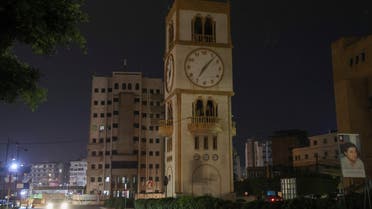 A car drives near a clock tower in Jdeideh, Lebanon March 25, 2023. (Reuters)