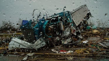 Destroyed semi trucks are seen through a car window as Mississippi braces for another round of potentially severe weather after thunderstorms spawning high straight-line winds and tornadoes ripped across the state in Rolling Fork, Mississippi, US, on March 26, 2023. (Reuters)