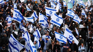 Demonstrators come out in support of Israel's nationalist coalition government and its plans for a judicial overhaul, in Jerusalem, March 27, 2023. (Reuters)