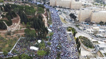 An aerial view shows protesters attending a demonstration after Israeli Prime Minister Benjamin Netanyahu dismissed the defense minister and his nationalist coalition government presses on with its judicial overhaul, in Jerusalem, March 27, 2023. REUTERS/Stringer NO RESALES. NO ARCHIVES