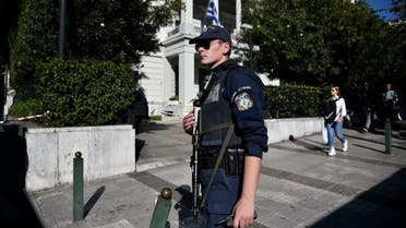 A police officer stands guard outside the foreign ministry building in Athens, Greece. (Reuters)