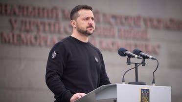 This handout photograph taken and released by Ukrainian Presidential press-service on March 24, 2023, shows the President Volodymyr Zelenskyy addressing a speech during a ceremony of the 9th anniversary of the National Guard of Ukraine and the graduation of the officers of the National Academy of Ukraine, in Kyiv. (AFP)