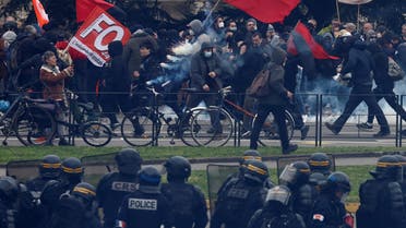 Protesters face off with French CRS riot police amid clashes during a demonstration as part of the ninth day of nationwide strikes and protests against French government’s pension reform, in Nantes, France, on March 23, 2023. (Reuters)