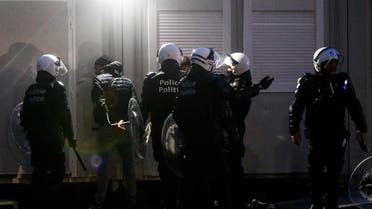 Police officers detain demonstrators during a protest against the Belgian government's restrictions imposed to contain the spread of the coronavirus disease (COVID-19), in Brussels, Belgium December 5, 2021. (Reuters)