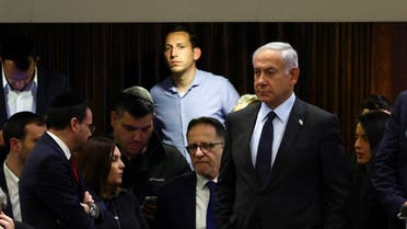 Israeli Prime Minister Benjamin Netanyahu attends a meeting at the Knesset, Israel’s parliament, amid demonstrations after he dismissed the defence minister as his nationalist coalition government presses on with its judicial overhaul, in Jerusalem, on March 27, 2023. (Reuters)