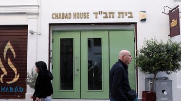 People walk past the entrance of an Israeli restaurant, following the arrest by Greek police of two suspected members of a group that was planning an attack against the restaurant, in Athens, Greece, on March 29, 2023. (Reuters)