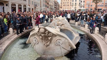 A photo taken and issued as a handout on April 1, 2023 by environmental activists of Last Generation shows the Barcaccia Fountain at Piazza di Spagna in Rome's historic center, after the activists poured black liquid as part of a campaign to raise awareness about climate change. (AFP)