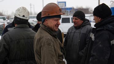 Miners are seen near the Listvyazhnaya coal mine outside the town of Belovo in the Kemerovo region on November 27, 2021. (AFP)