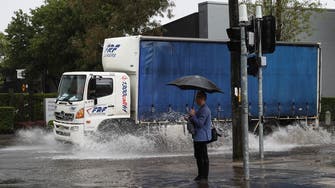 Sydney residents sandbag houses as heavy rain brings flash flooding, prompts rescues