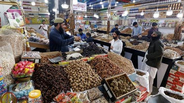 2023People buy dry fruits at a market in Karachi, Pakistan, on February 1, 2023. (Reuters)-02-01T121815Z_1468024474_RC2C2Z948PQT_RTRMADP_3_PAKISTAN-INFLATION
