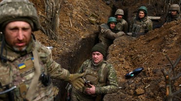 Ukrainian service members from 28th mechanised brigade remain in their trenches after incoming fire at the frontline, amid Russia’s attack on Ukraine in the region of Bakhmut, Ukraine, April 5, 2023. REUTERS/Kai Pfaffenbach TPX IMAGES OF THE DAY