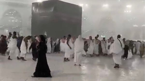 Scenes that capture hearts.. Umrah performers under the rain at the Grand Mosque