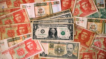 Cuban and U.S. notes are seen in this illustrative photograph taken in Havana March 14, 2011. (File photo: Reuters)
