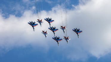 Russian Air Force aerobatic teams ‘Strizhi’ (Swifts) on MiG-29 aircrafts and ‘Russian Knights’ in Su-27 aircrafts perform during an air show at the MAKS 2021 International Aviation and Space Salon, in Zhukovsky, outside Moscow, on July 20, 2021. (AFP)