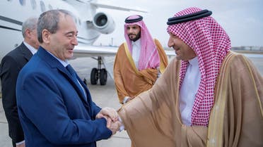 Saudi Arabia’s Vice Minister of Foreign Affairs, Walid Elkhereiji greets Syrian FM Faisal Mekdad in Jeddah, Saudi Arabia, April 12, 2023. (Reuters)