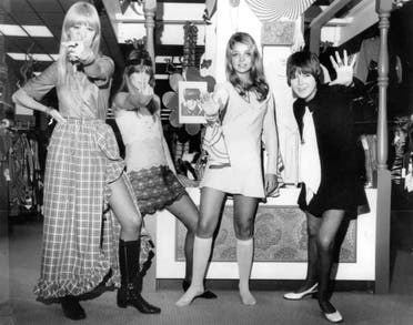  British fashion designer Mary Quant, right, waves as she poses with models, from left, from left, are, Amanda Tear, Rory Davis and Penny Yates, wearing her Mod creations in Little Rock, Ark. on Oct. 25, 1968. (AP)