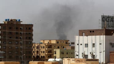 Smoke rises above buildings in Khartoum on April 15, 2023, amid reported clashes in the city. (AFP)